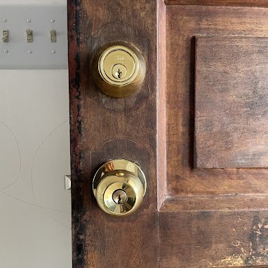 Residential locksmith installing or servicing a home door lock in Miami, Florida